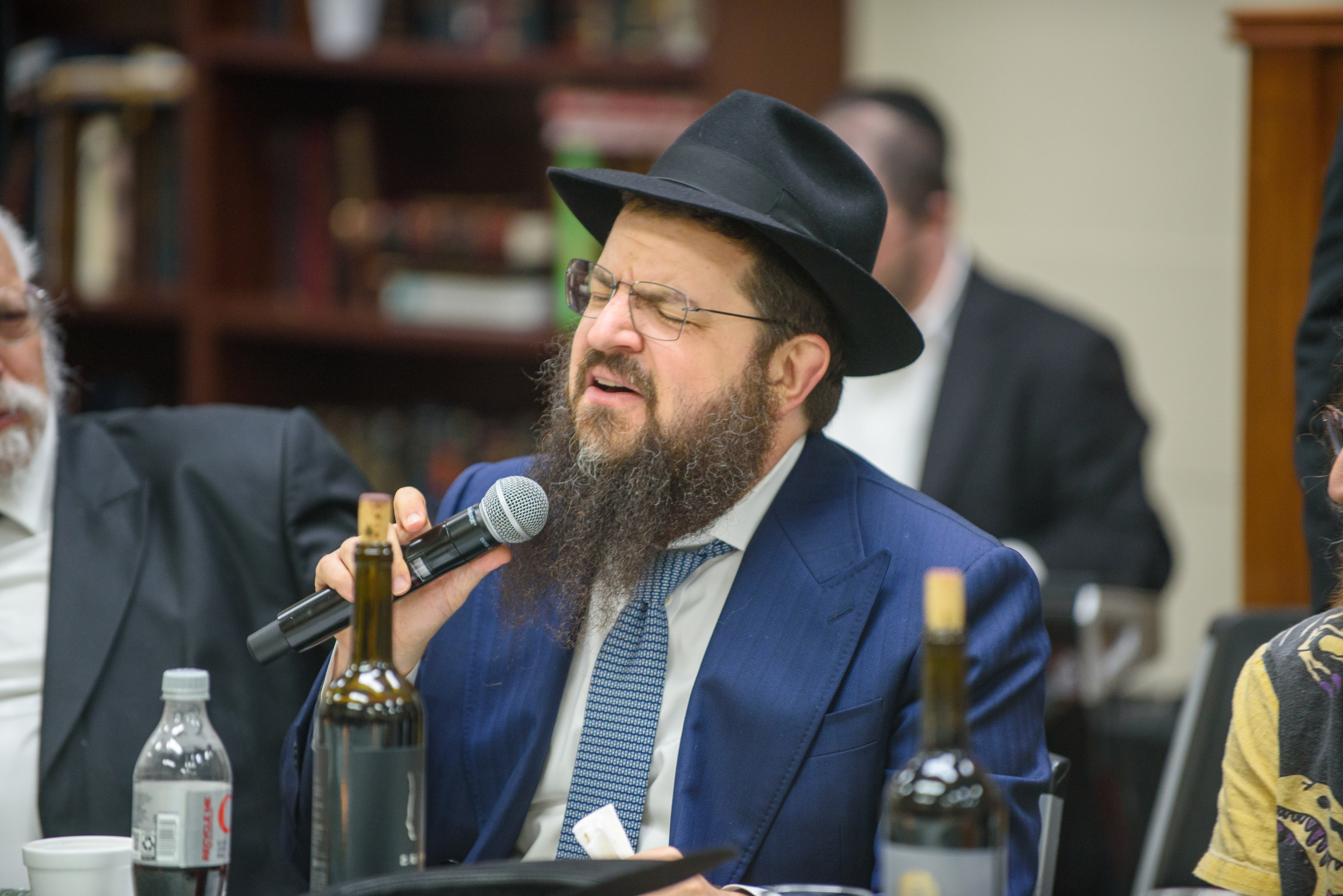 Benny Friedman performing at the community farbrengen