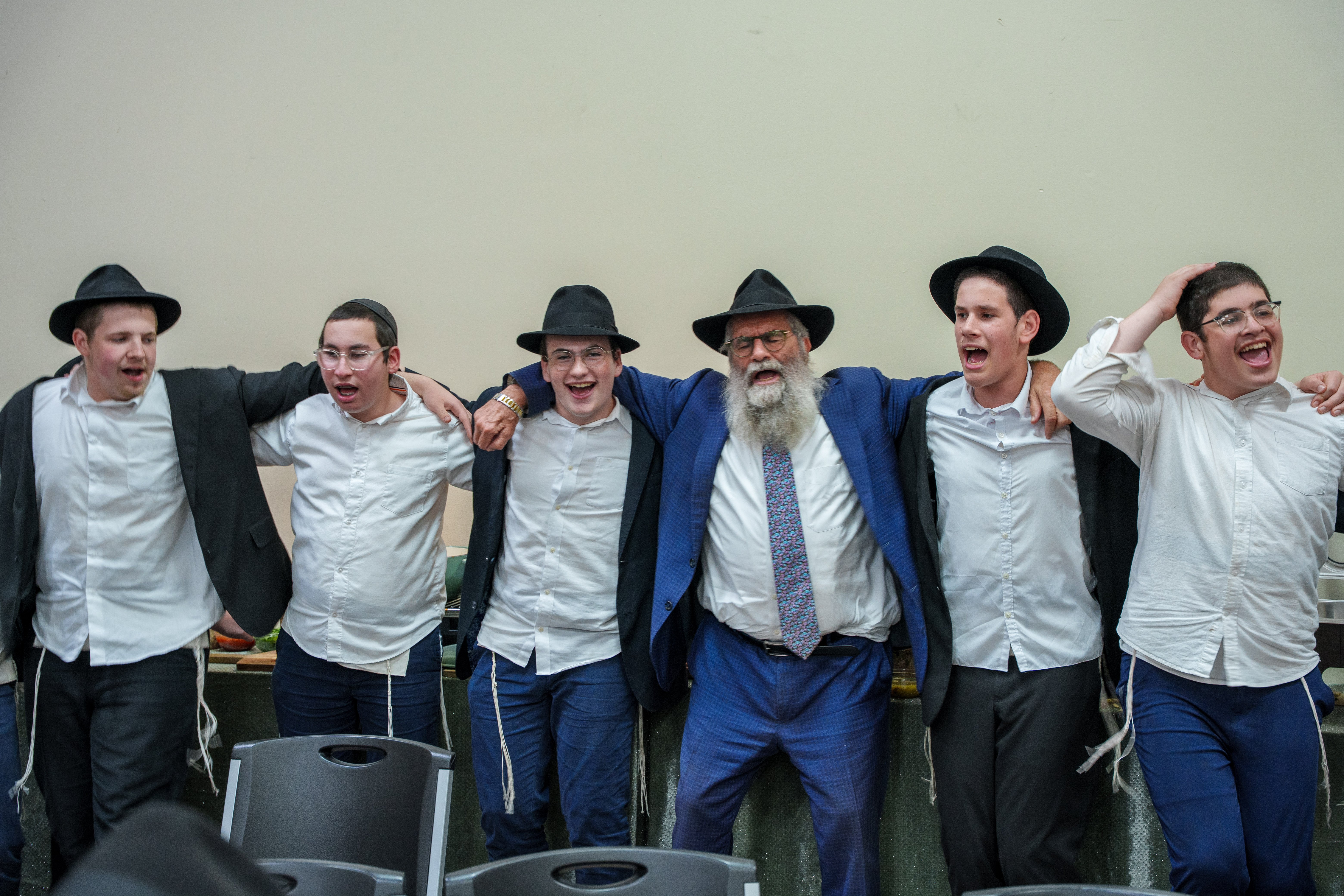 Bochurim singing at the community farbrengen
